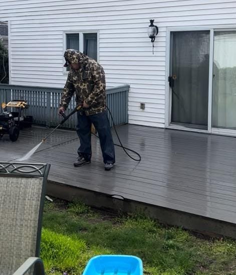 David pressure washing a residential deck