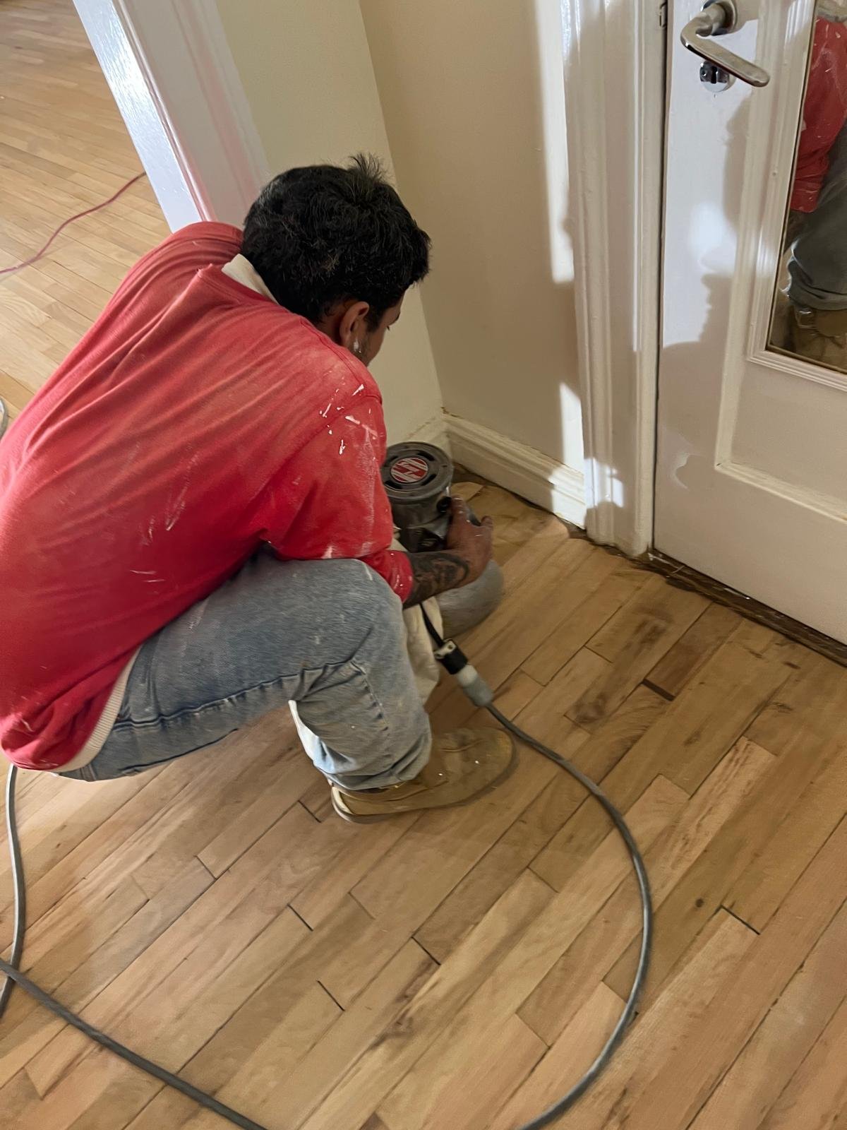 Hardwood floor sanding in progress